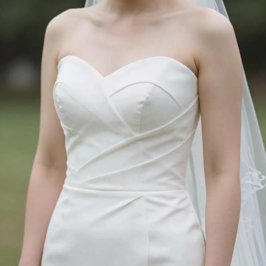 Same wedding photo after recovery with restored fabric texture in the dress and balanced exposure